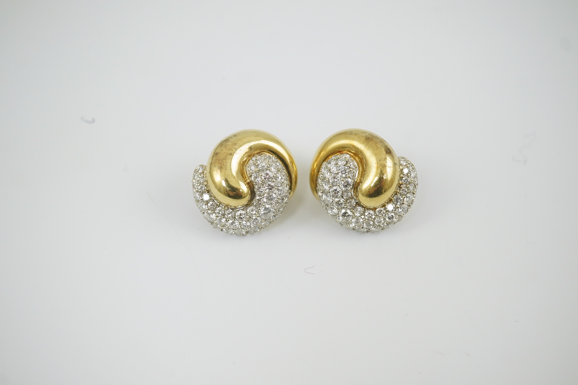 A modern pair of Mappin & Webb 18ct gold and diamond cluster set 'ying and yang' earrings